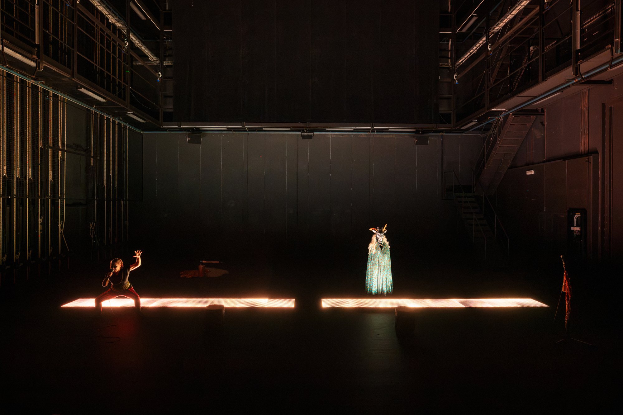 Difference and Repetition: performers and light across a dark stage